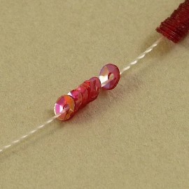 cup sequin3 mm  iridescent pinky red on strand