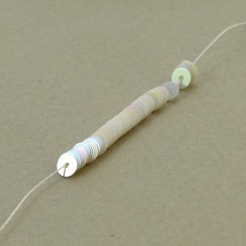 Flat sequin 4 mm oriental ivory on strand