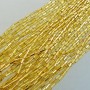 Bugle beads 4 mm facetted dark gold on strand